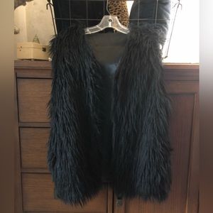 Black fur hydraulic vest with side pockets and hidden inside pockets satin lined